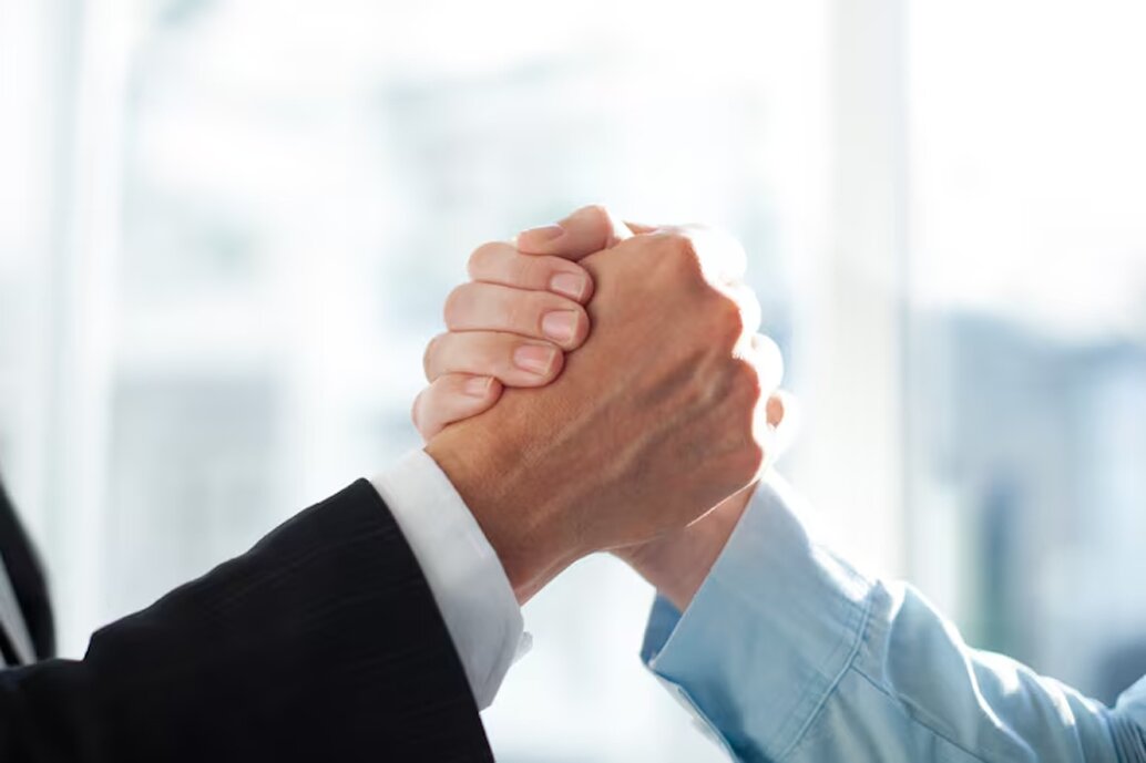 Handshake representing Blanco's Roofing commitment to every customer